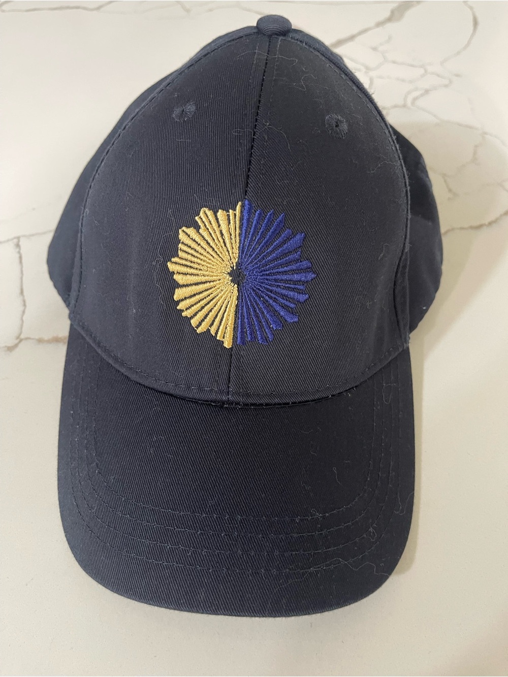 Navy Cap with Yellow & Blue Embroidered Sunburst